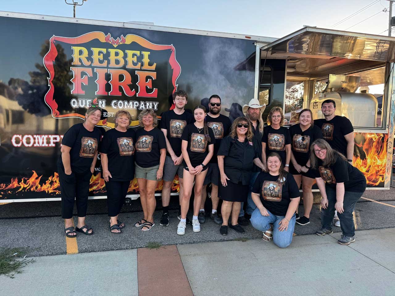 Todd and Marie pictured with their employees at their sauce launch party in 2024